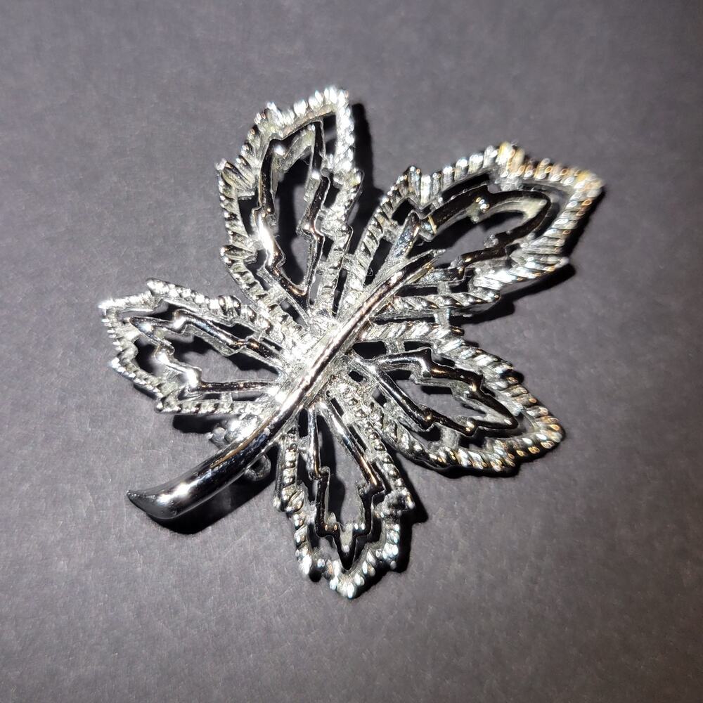 Silver tone leaf brooch